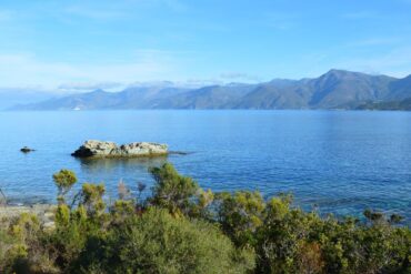 Home Stunning view of the coastline and mountains in Patrimonio, Corsica, France.